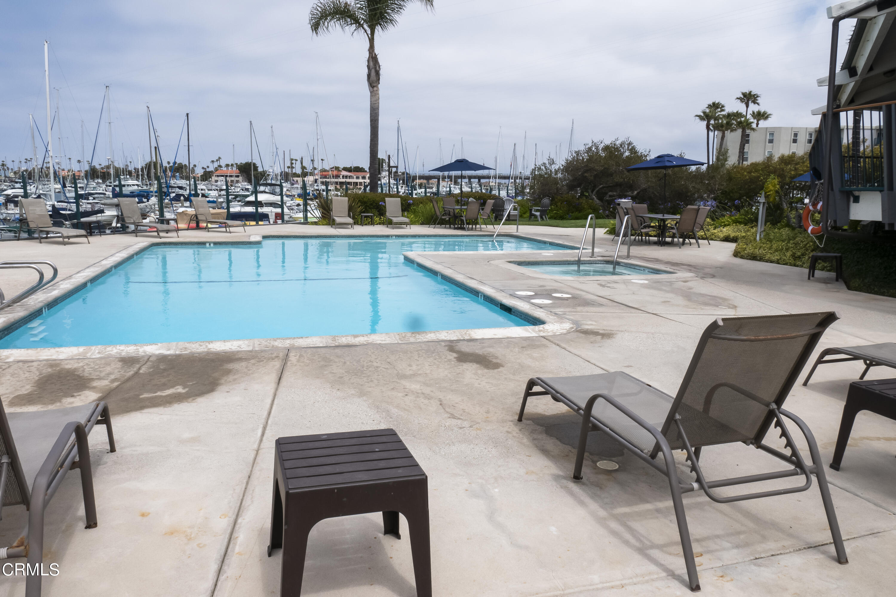 3101 Peninsula Road, Unit 307 Oxnard, CA 93035 - Photo 15 of 22 a view of a swimming pool with chairs