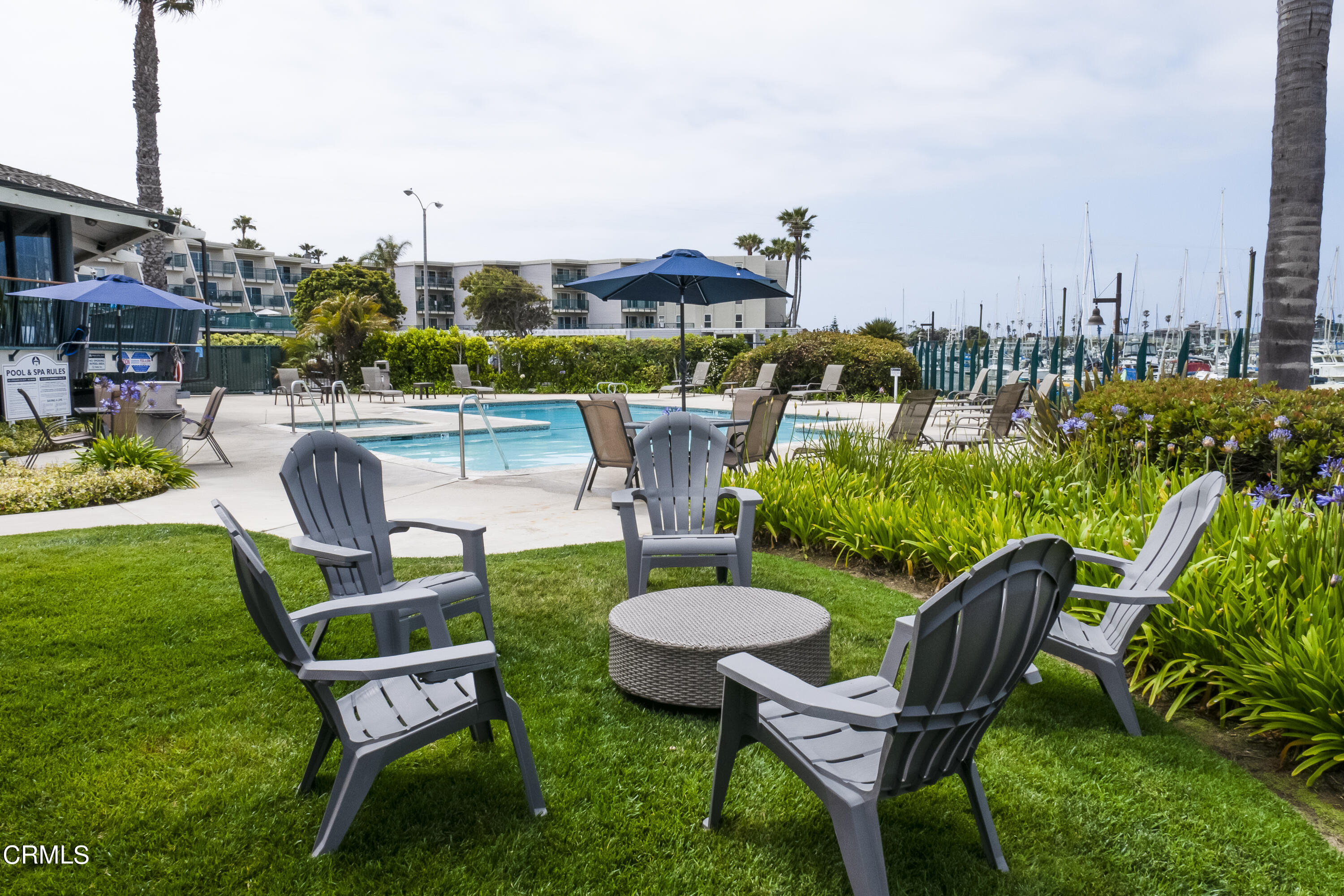 3101 Peninsula Road, Unit 307 Oxnard, CA 93035 - Photo 16 of 22 a view of a chairs and table in backyard of the house