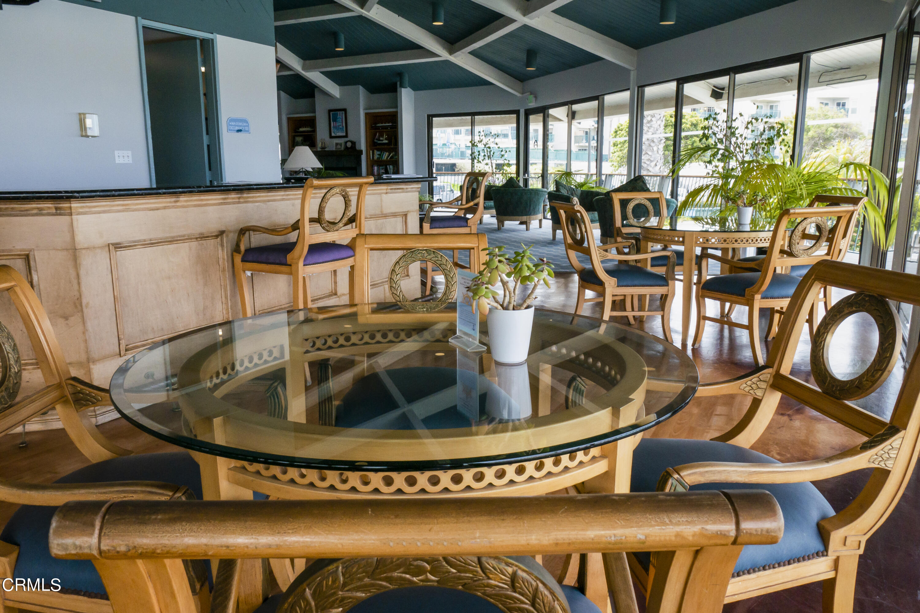 3101 Peninsula Road, Unit 307 Oxnard, CA 93035 - Photo 20 of 22 a view of a living room with a dining table and chairs