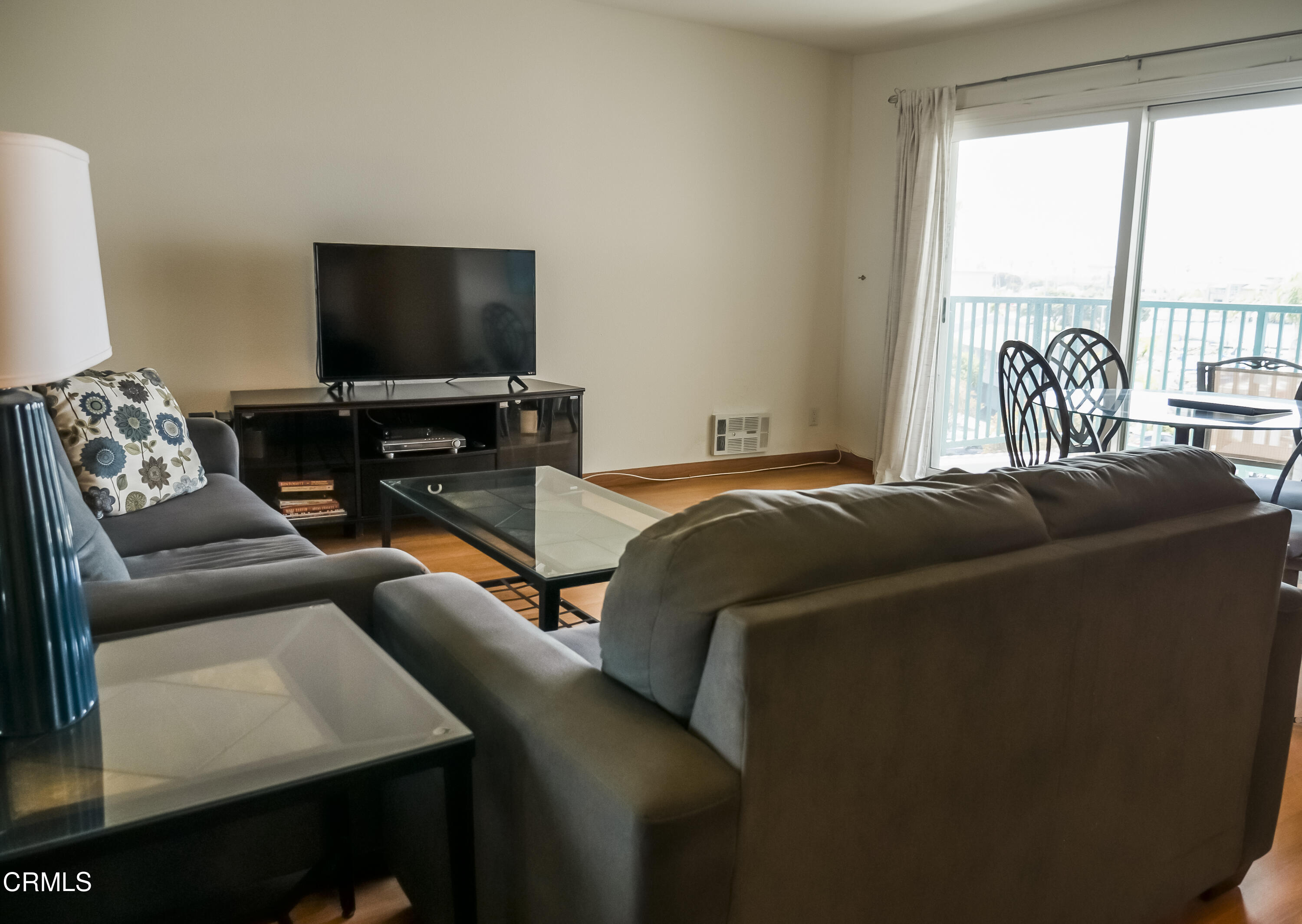 3101 Peninsula Road, Unit 307 Oxnard, CA 93035 - Photo 3 of 22 a living room with furniture and a flat screen tv