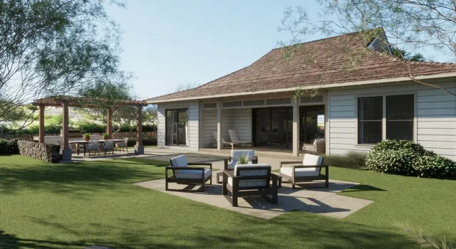 a view of a house with backyard porch and sitting area