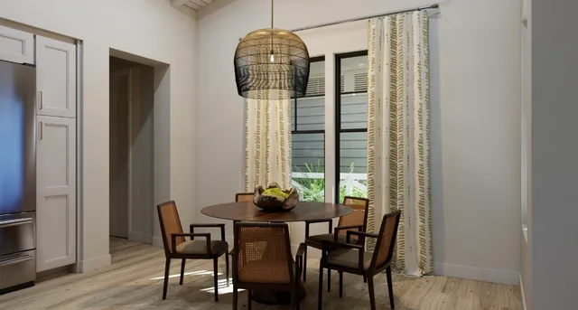 a dining room with furniture and window