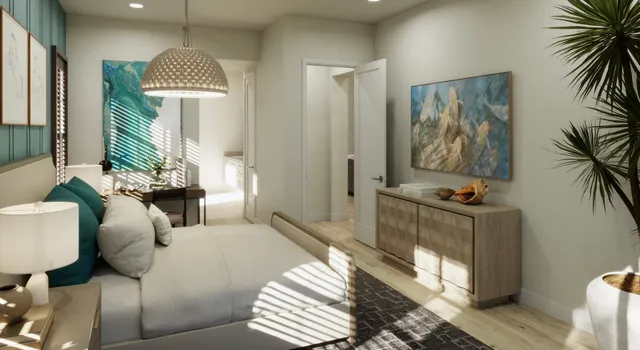 a bedroom with furniture and a potted plant