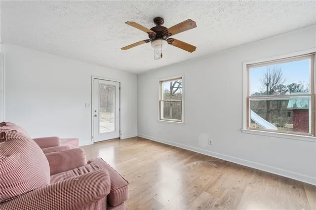 a bedroom with furniture and wooden floor