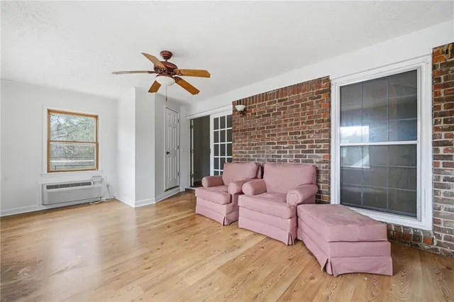 a view of a livingroom with wooden floor