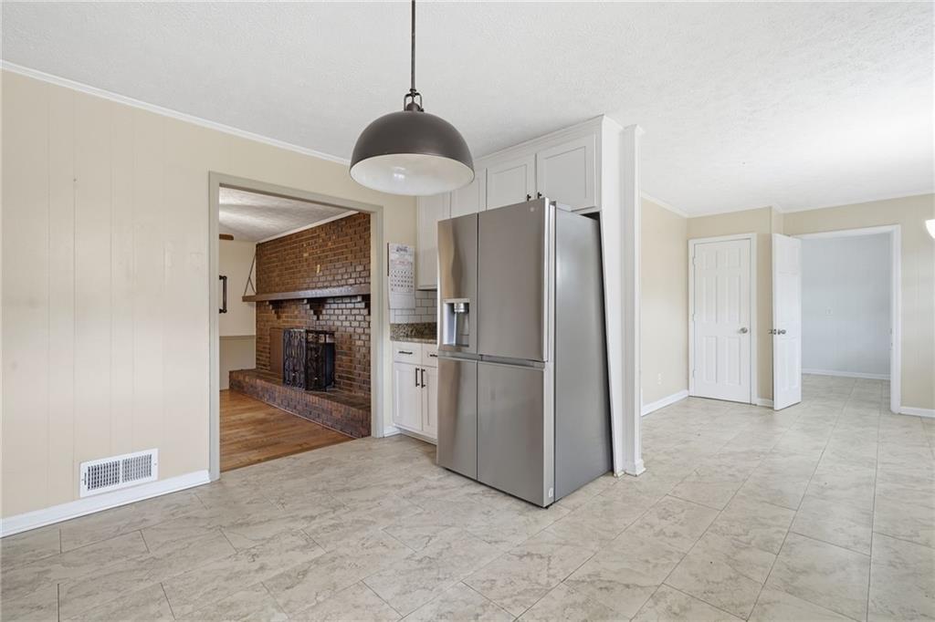 253 Newt Fowler Lane Canton, GA 30115 - Photo 20 of 35 a view of a kitchen with a sink and refrigerator