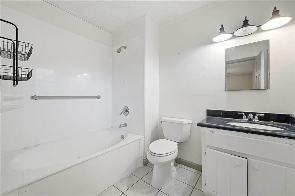 253 Newt Fowler Lane Canton, GA 30115 - Photo 34 of 35 a bathroom with a sink a toilet and bathtub