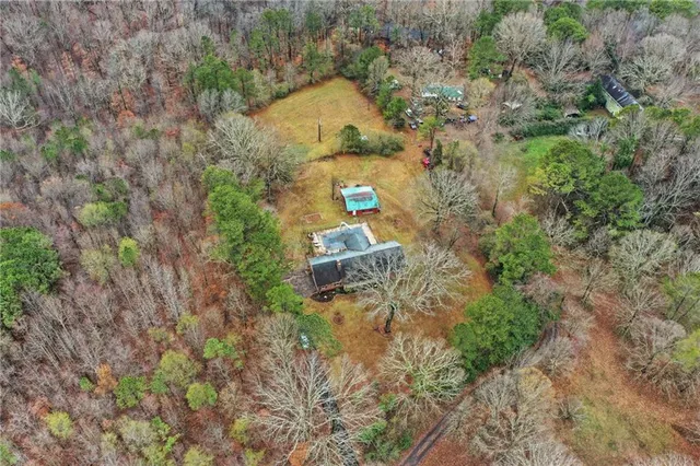 a view of a brick wall with a bench