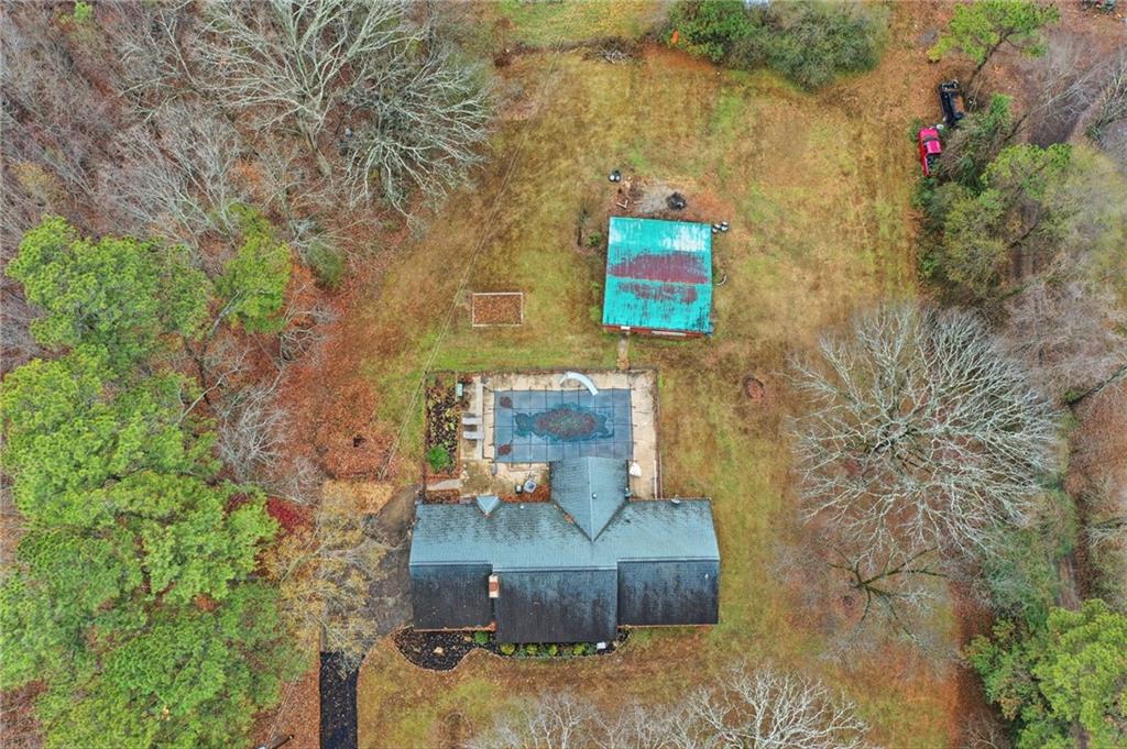 253 Newt Fowler Lane Canton, GA 30115 - Photo 10 of 35 a view of a brick wall with a bench