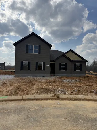 a front view of a house with yard