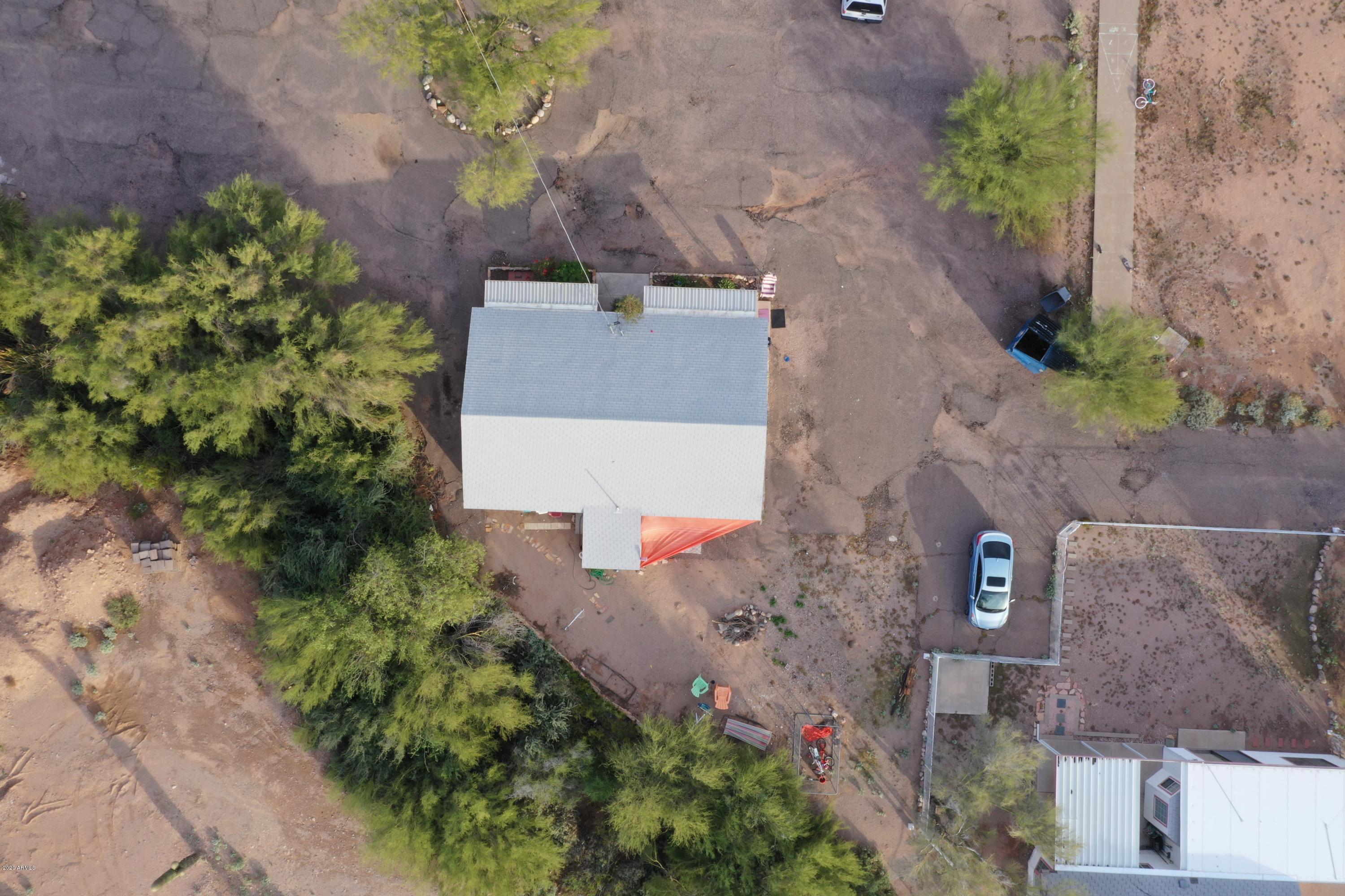 204 North Cactus Road Apache Junction, AZ 85119 - Photo 6 of 8 an aerial view of a house with a yard and a large tree