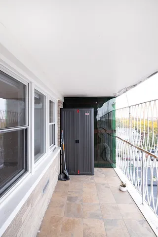 a view of a house with wooden floor and a gate