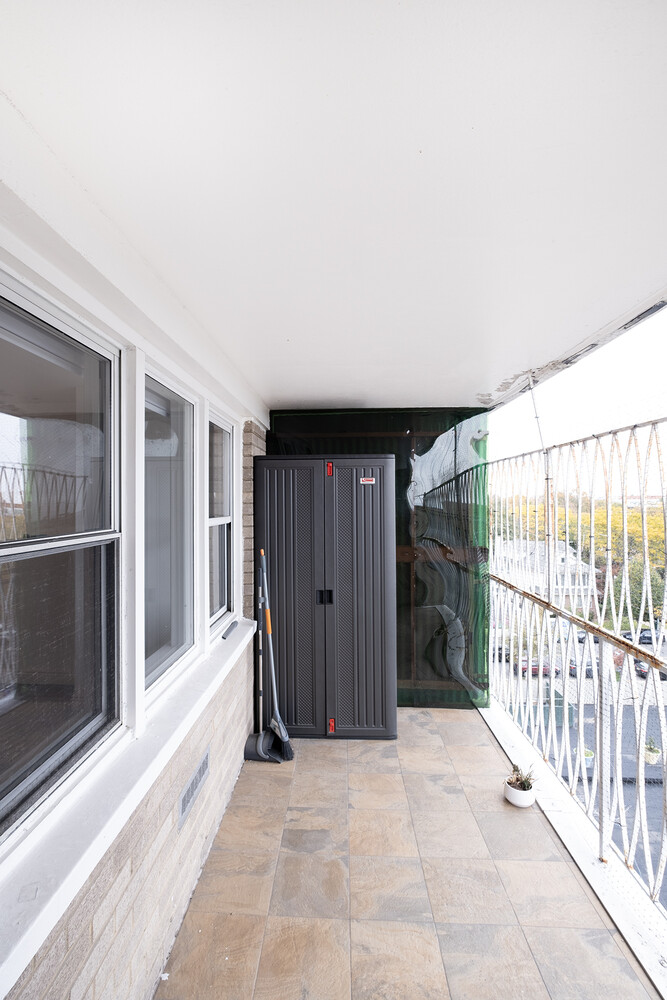 1401 Ocean Avenue, Unit 6H Brooklyn, NY 11230 - Photo 6 of 10 a view of a house with wooden floor and a gate