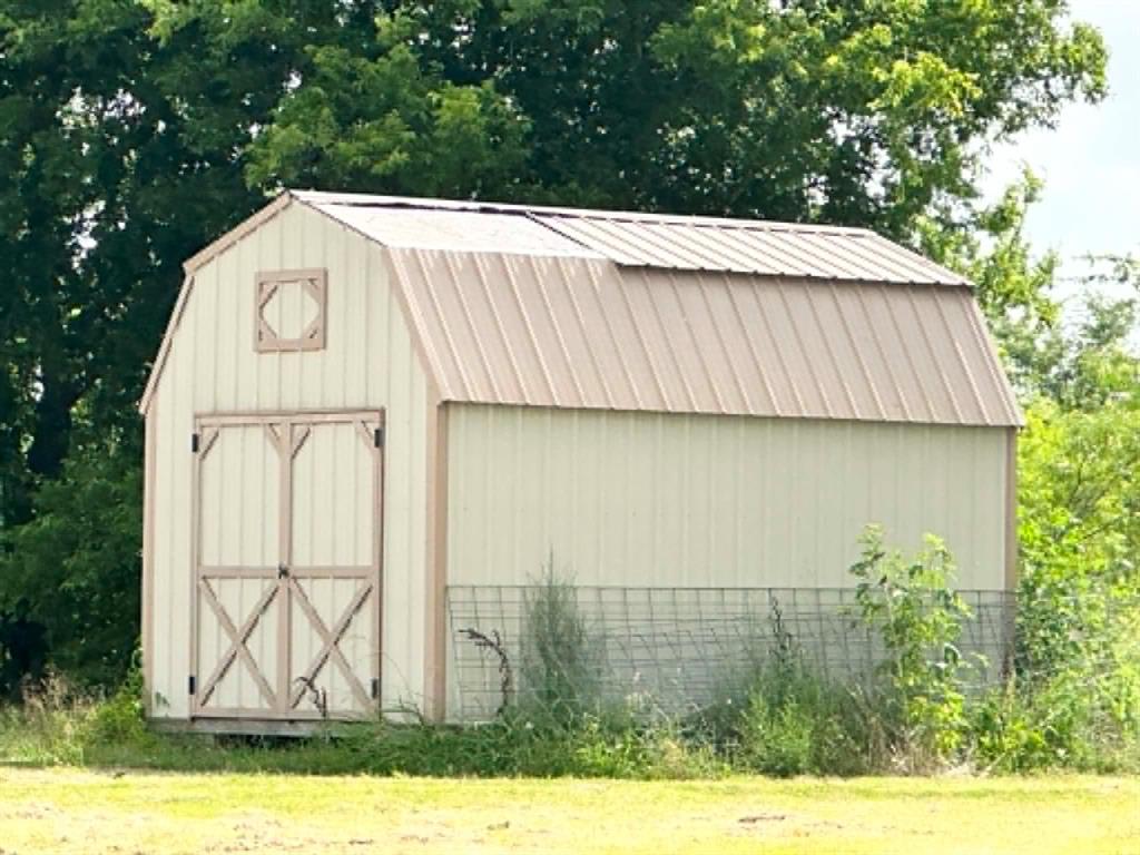 1275 John Wayne Road Kaufman, TX 75142 - Photo 5 of 11 Gambrel roof shed with light-colored siding