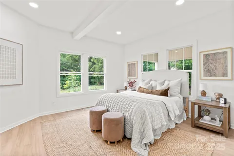 a bedroom with bed and a window