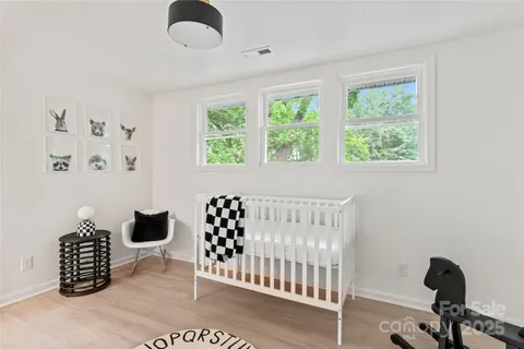 a bedroom with furniture and a window