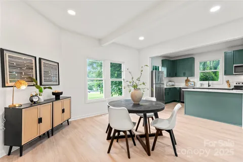 a dining room with furniture and window