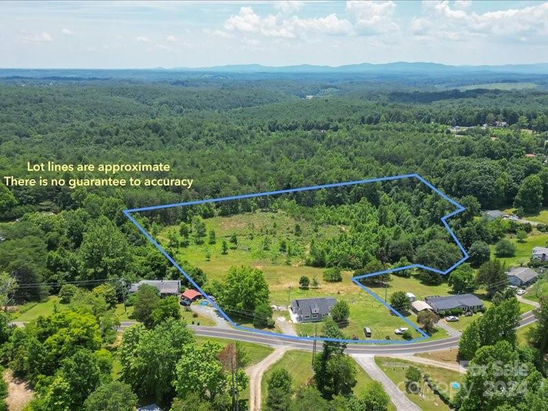 4080 Piney Road Morganton, NC 28655 - Photo 2 of 23 a view of a city with lush green forest