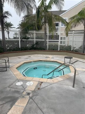 a small pool with table and chairs