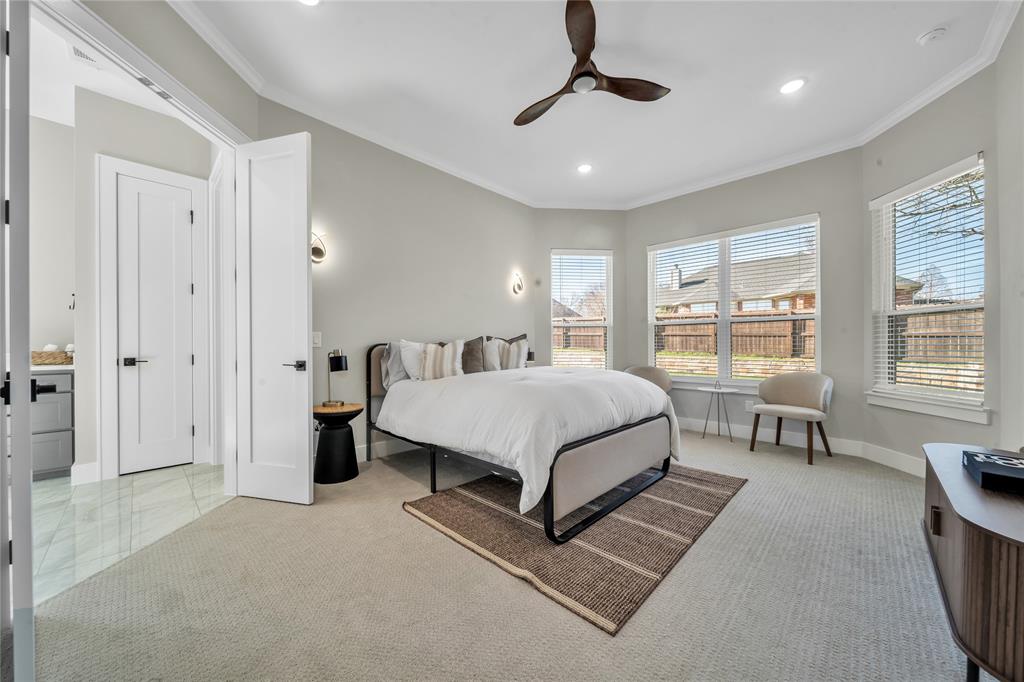 904 Tannehill Way Athens, TX 75751 - Photo 11 of 18 a spacious bedroom with a bed a table and large window
