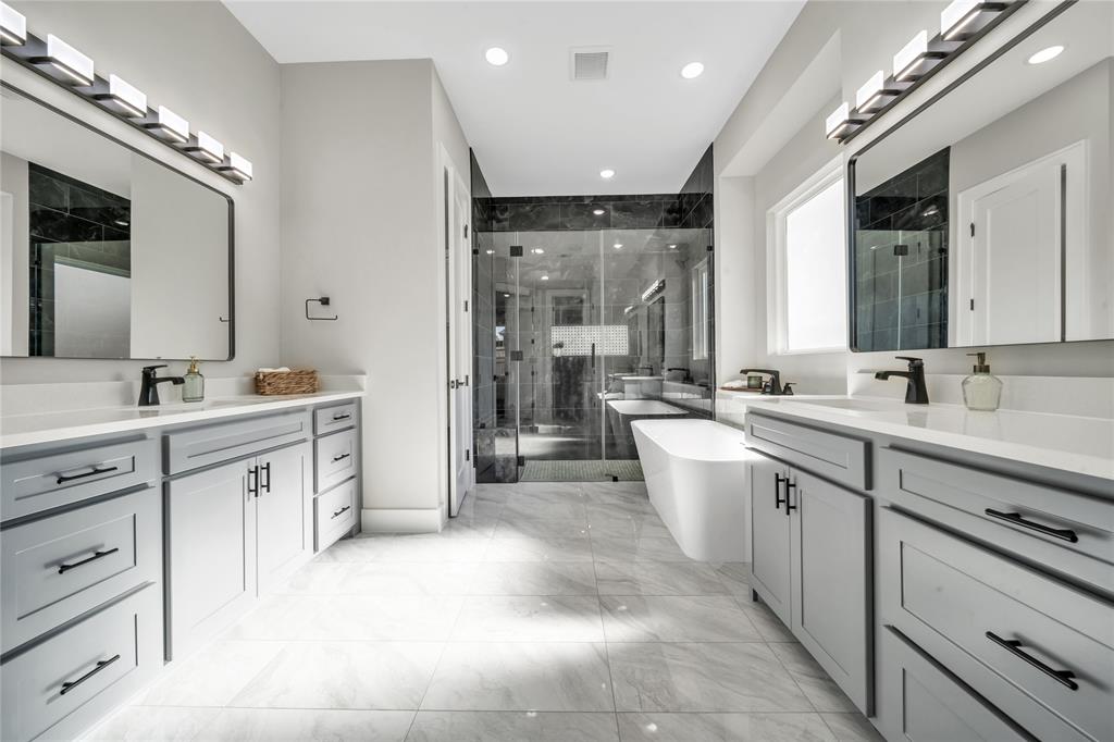 904 Tannehill Way Athens, TX 75751 - Photo 12 of 18 a large white bathroom with a double vanity sink mirror and a bathtub