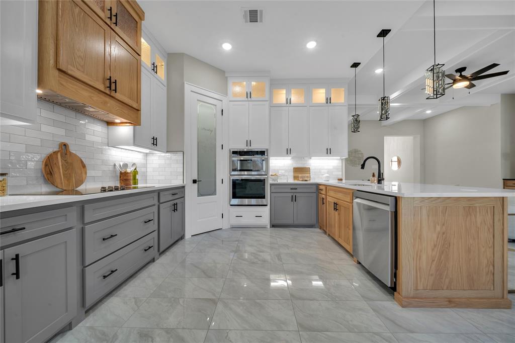 904 Tannehill Way Athens, TX 75751 - Photo 5 of 18 a kitchen with cabinets a sink and appliances