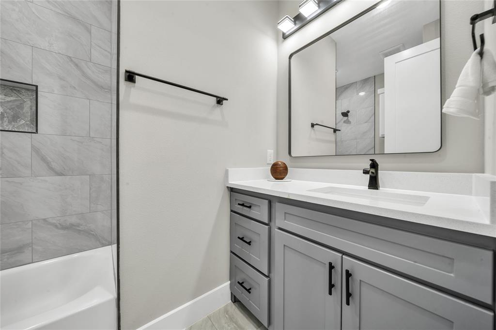 904 Tannehill Way Athens, TX 75751 - Photo 7 of 18 a bathroom with a sink and a mirror
