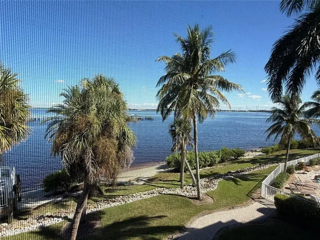 a view of three houses with yard