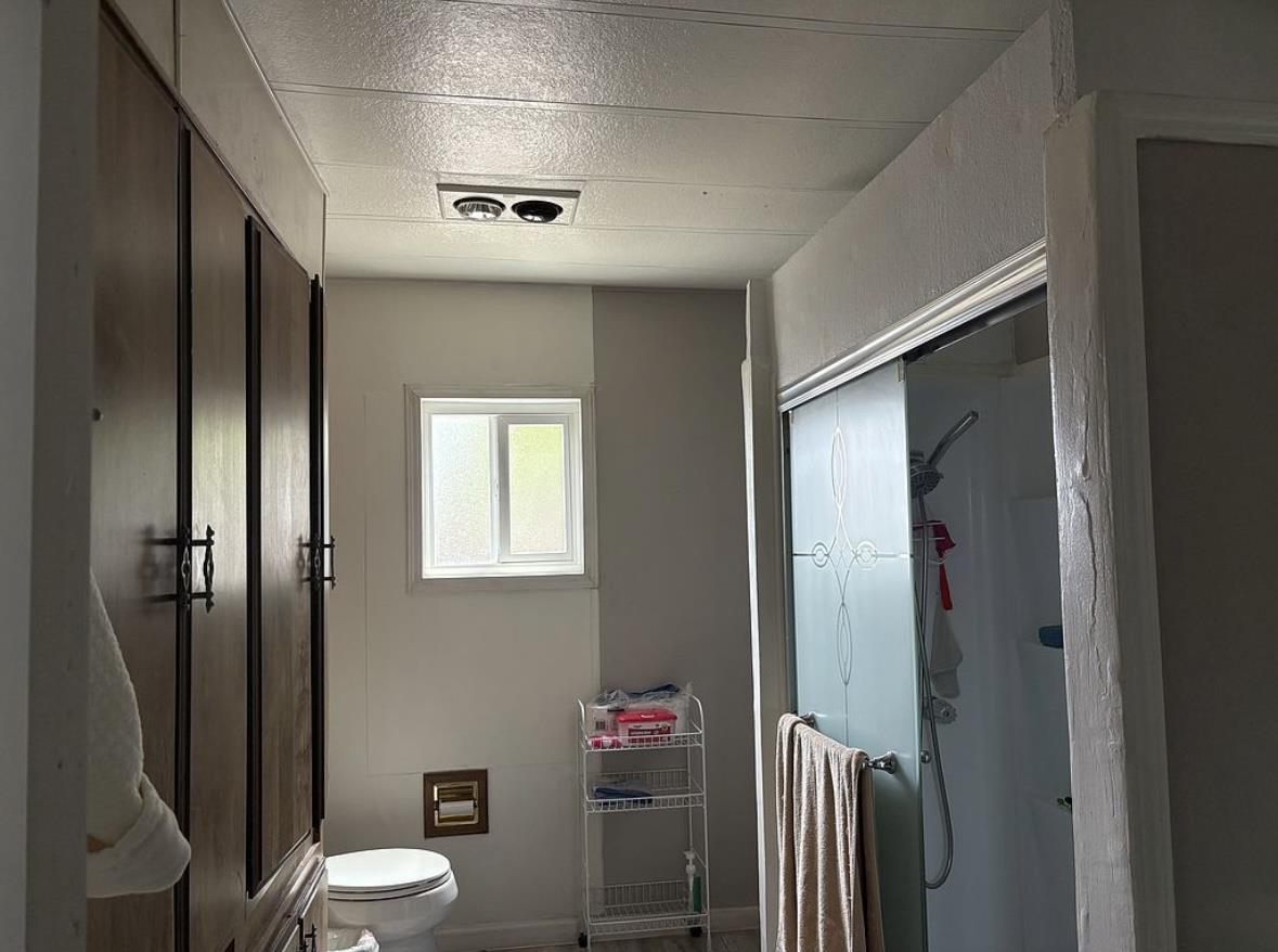 4271 North 1st Street, Unit 124 San Jose, CA 95134 - Photo 11 of 12 a bathroom with a toilet a sink and shower