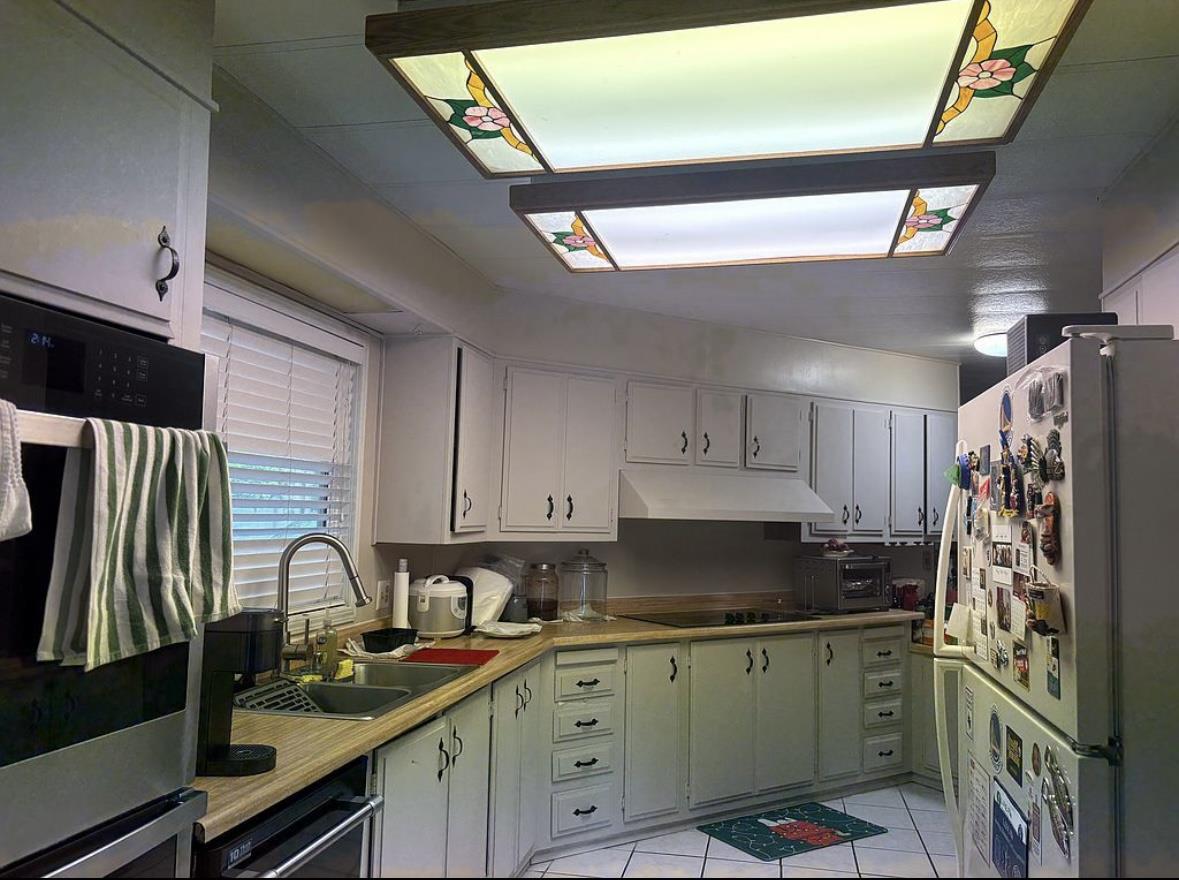 4271 North 1st Street, Unit 124 San Jose, CA 95134 - Photo 6 of 12 a kitchen with stainless steel appliances granite countertop a sink stove and cabinets
