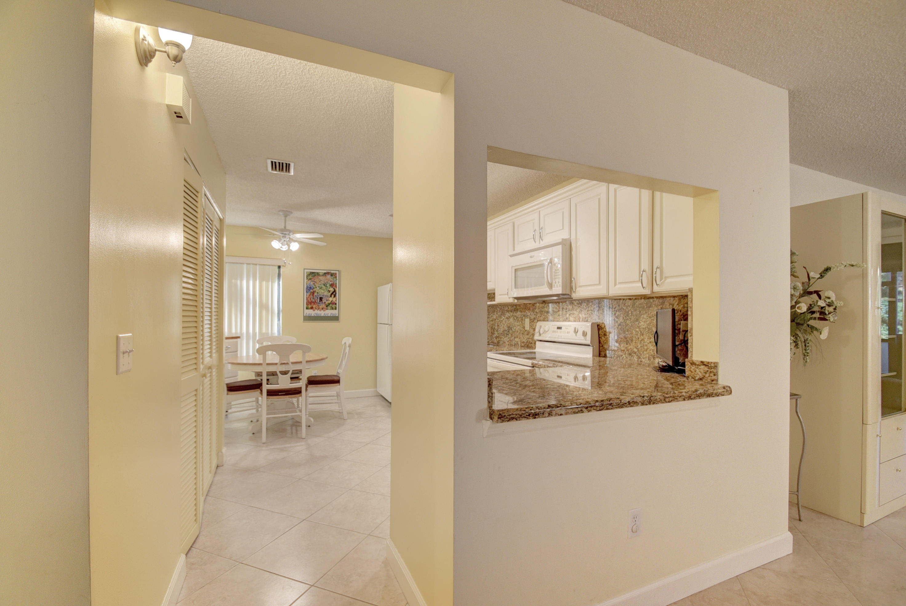 9246 Sable Ridge Circle, Unit A Boca Raton, FL 33428 - Photo 5 of 15 Pass Through Kitchen