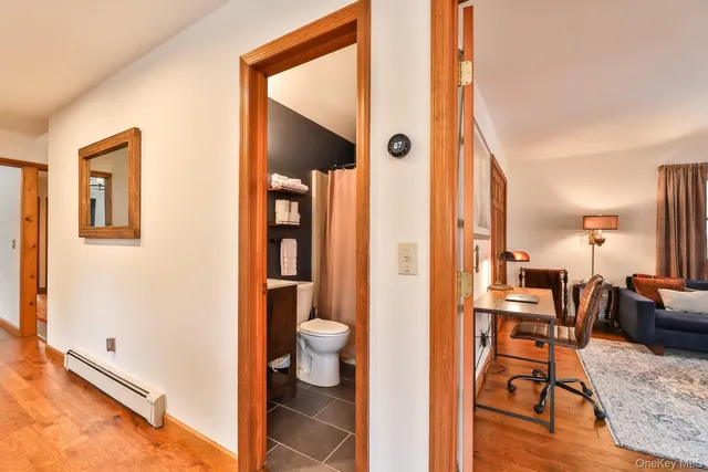 a view of bathroom with a sink and a mirror