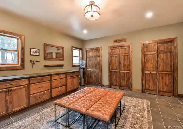 a spacious bathroom with a granite countertop sink and a mirror