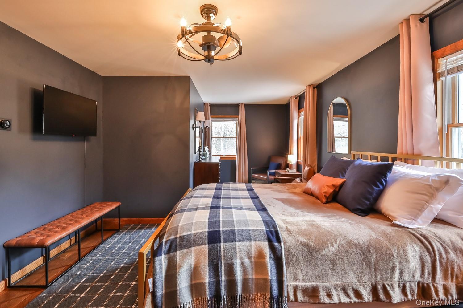 61 Mt View Estates Road Windham, NY 12496 - Photo 23 of 38 a bedroom with a bed and a flat screen tv