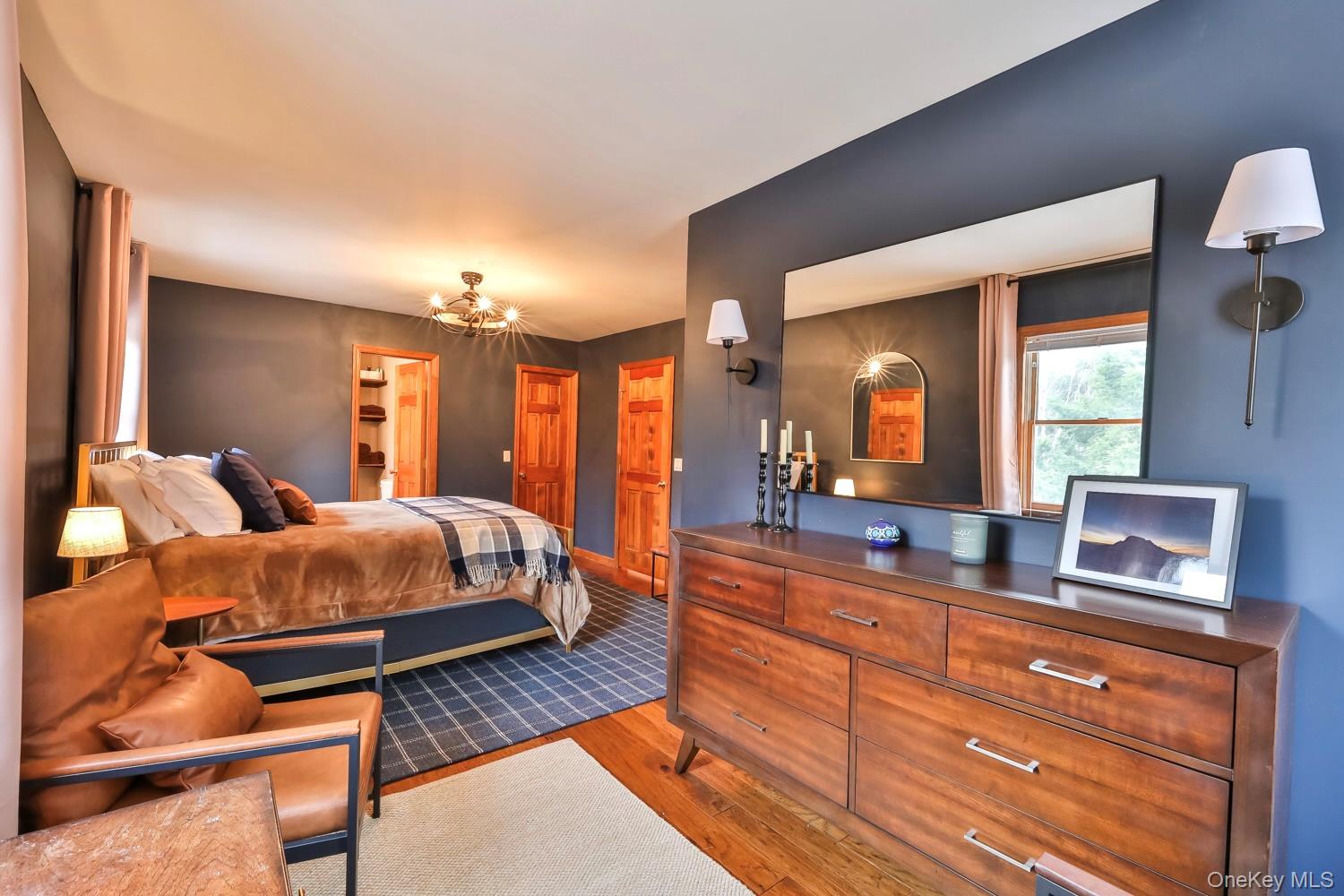 61 Mt View Estates Road Windham, NY 12496 - Photo 24 of 38 Bedroom with light wood-type flooring and a chandelier