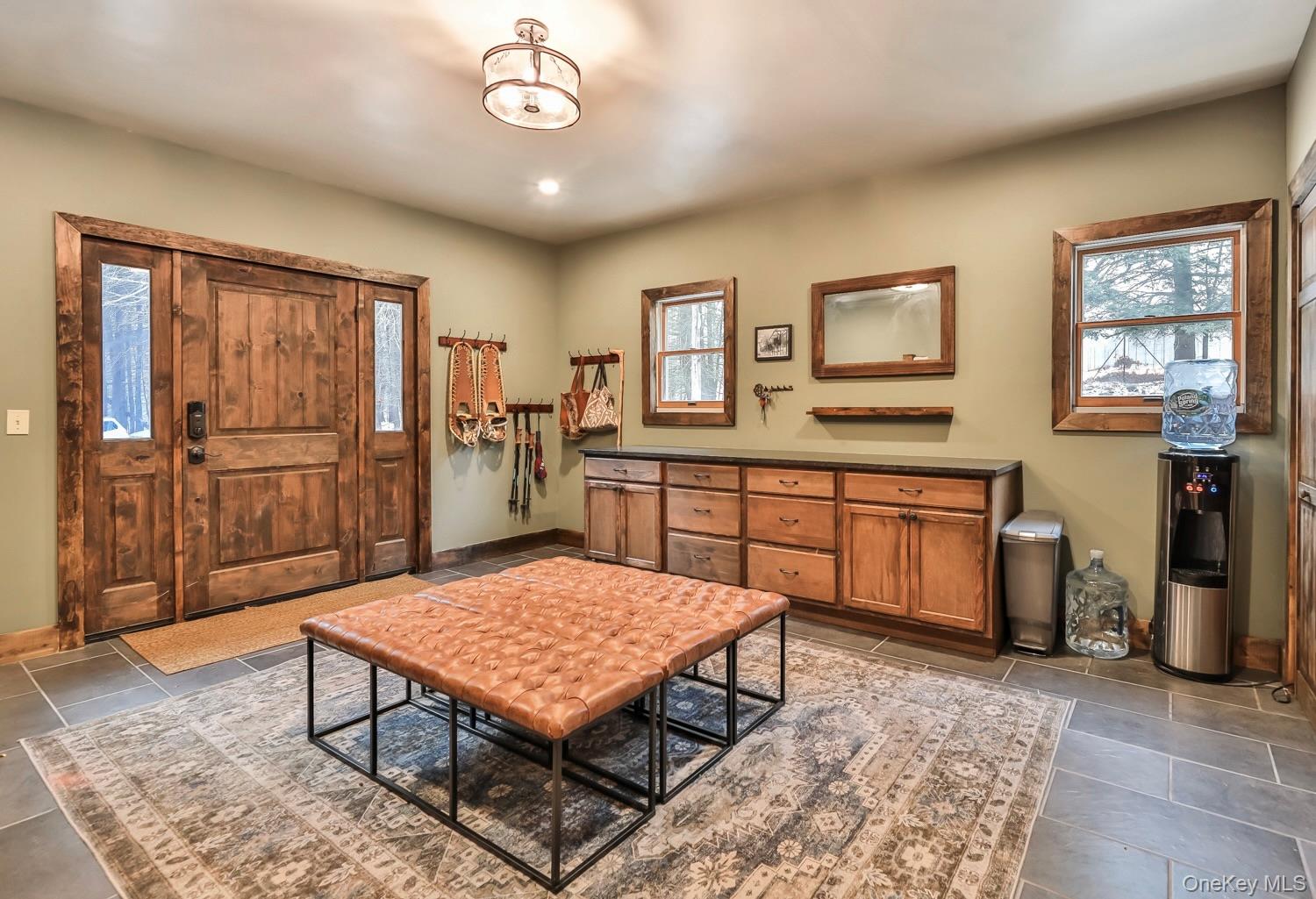 61 Mt View Estates Road Windham, NY 12496 - Photo 3 of 38 a living room with a dining table and paintings on the wall