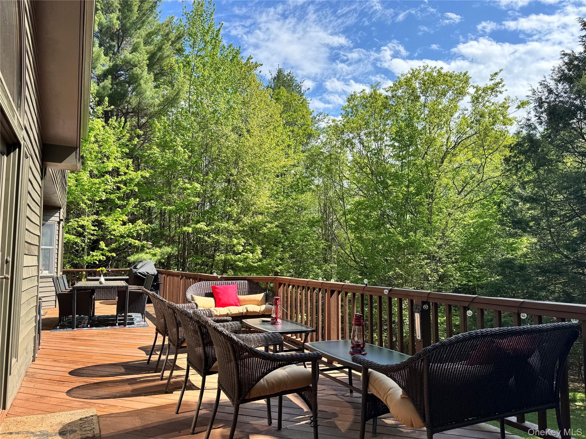 61 Mt View Estates Road Windham, NY 12496 - Photo 34 of 38 a balcony with wooden floor and outdoor seating