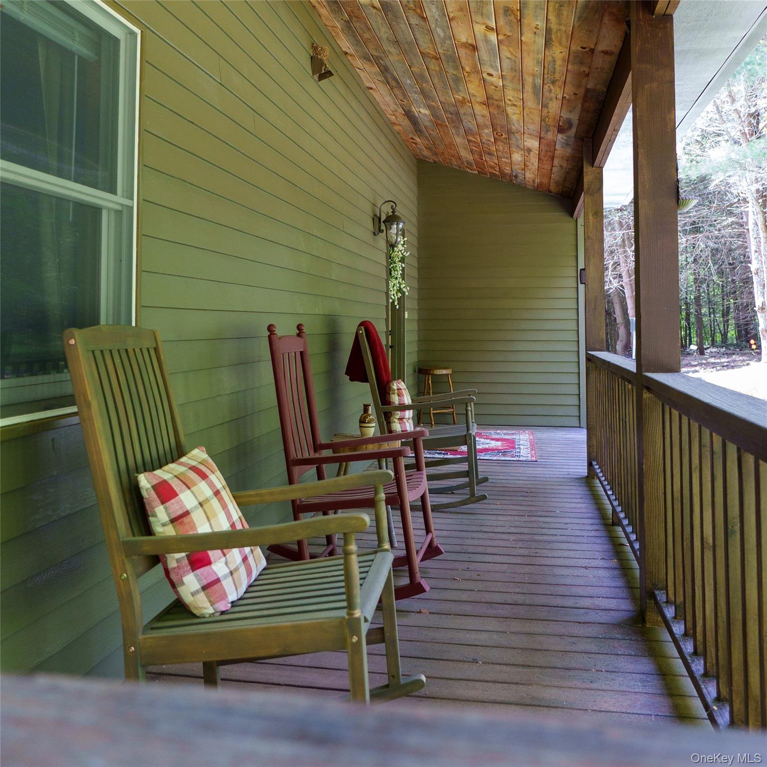 61 Mt View Estates Road Windham, NY 12496 - Photo 37 of 38 a view of outdoor seating space with wooden floor and windows
