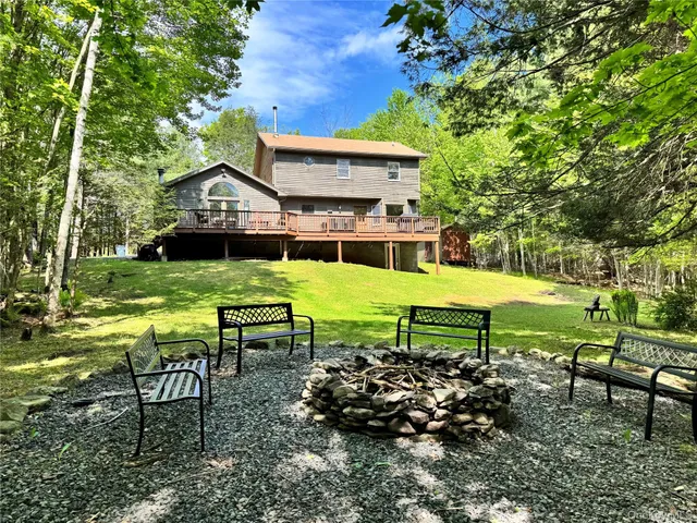 a view of a chairs and table in the garden