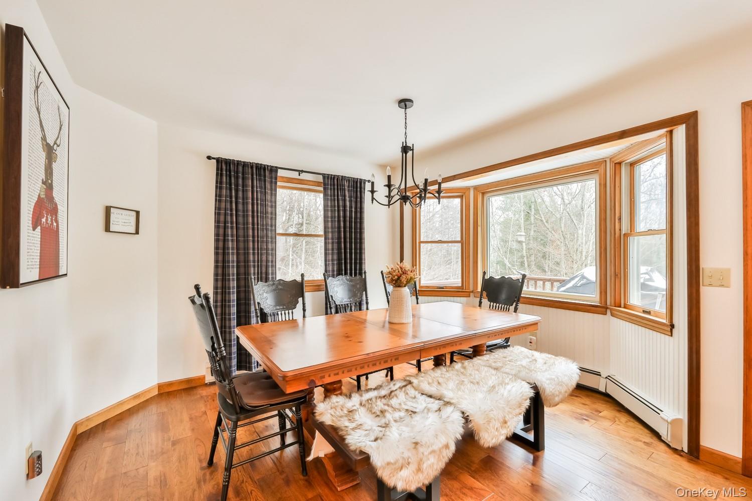 61 Mt View Estates Road Windham, NY 12496 - Photo 9 of 38 a dining room with furniture window wooden floor