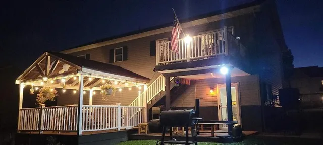 an aerial view of a houses with a swimming pool