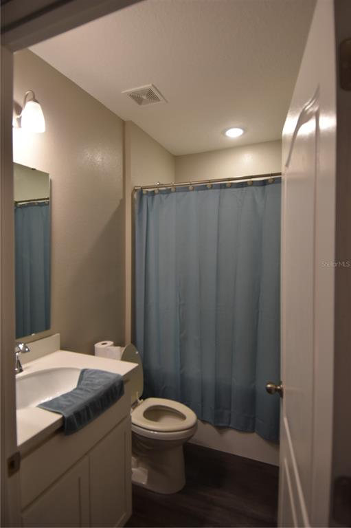 14241 Ravine Avenue Weeki Wachee, FL 34614 - Photo 11 of 48 a bathroom with a sink a toilet and shower
