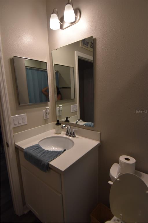14241 Ravine Avenue Weeki Wachee, FL 34614 - Photo 12 of 48 a bathroom with a sink and a mirror