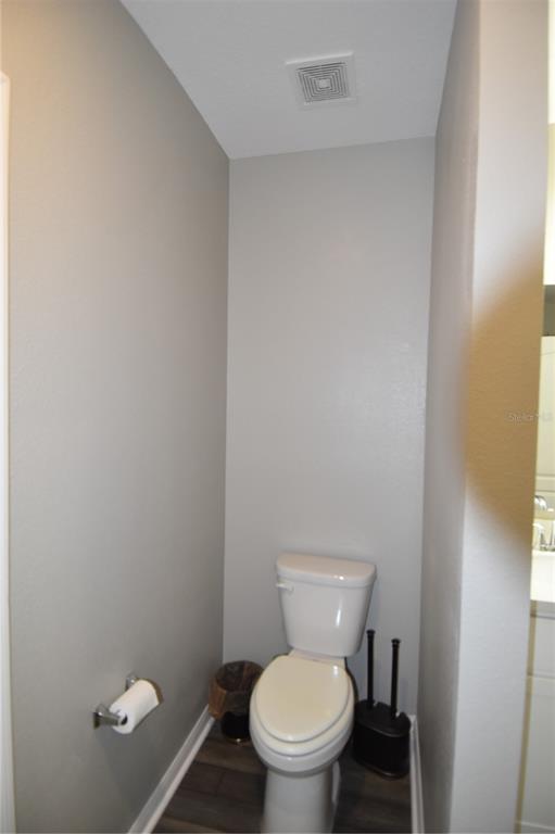 14241 Ravine Avenue Weeki Wachee, FL 34614 - Photo 21 of 48 a white toilet sitting next to a shower