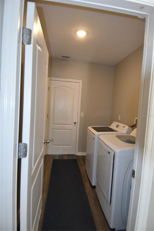 14241 Ravine Avenue Weeki Wachee, FL 34614 - Photo 26 of 48 a utility room with dryer and washer