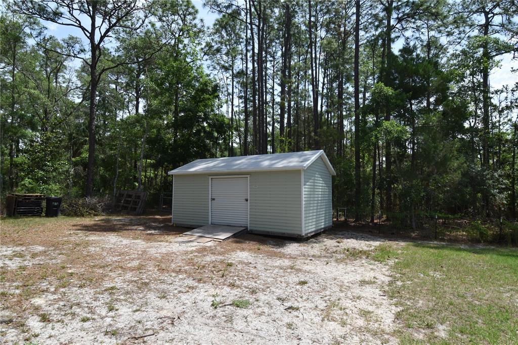 14241 Ravine Avenue Weeki Wachee, FL 34614 - Photo 30 of 48 a view of a backyard