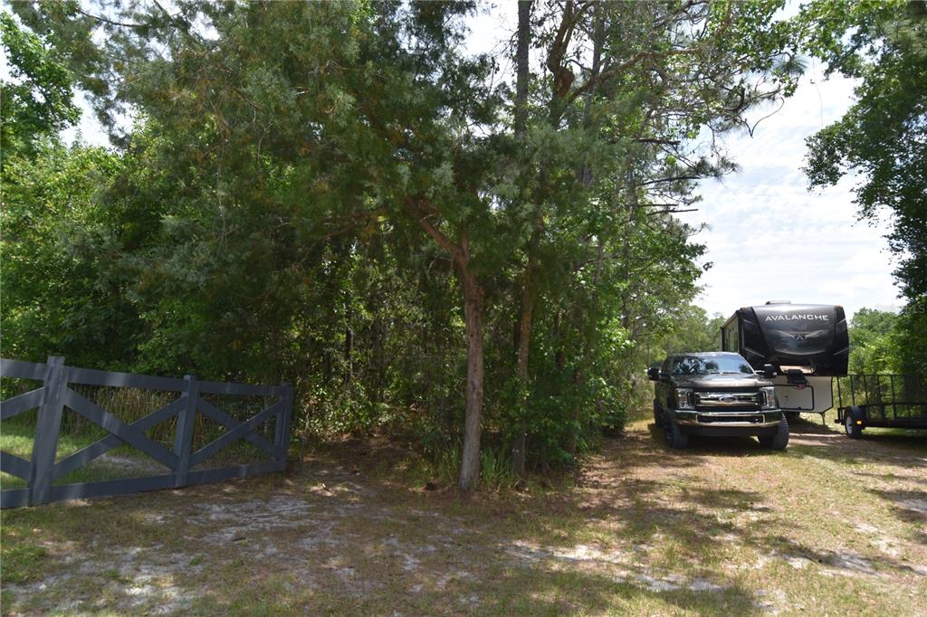 14241 Ravine Avenue Weeki Wachee, FL 34614 - Photo 39 of 48 a view of a car park in front of a house