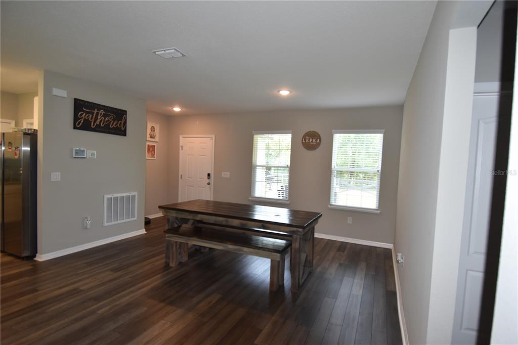 14241 Ravine Avenue Weeki Wachee, FL 34614 - Photo 9 of 48 a room with wooden floor and a window