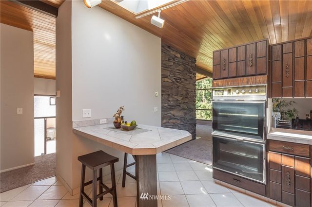 a kitchen with a sink cabinets and appliances