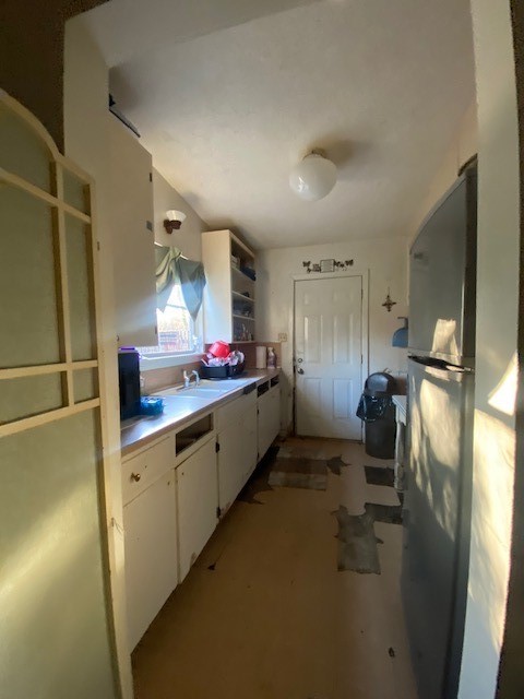 905 Neans Drive Austin, TX 78758 - Photo 12 of 40 a kitchen with refrigerator and window